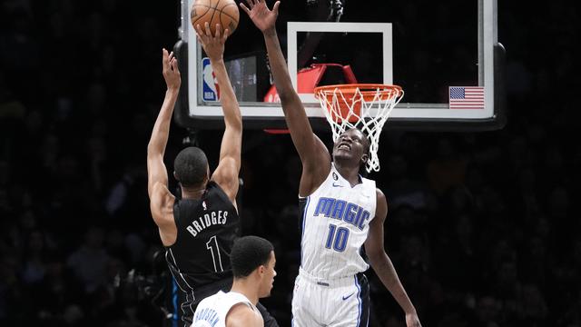 Brooklyn Nets forward Mikal Bridges (1) goes to the basket against Orlando Magic center Bol Bol (10) during the first half of an NBA basketball game Friday, April 7, 2023, in New York. 