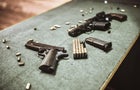 Modern Pistols And Gun Cartridges At Gun Training Range 
