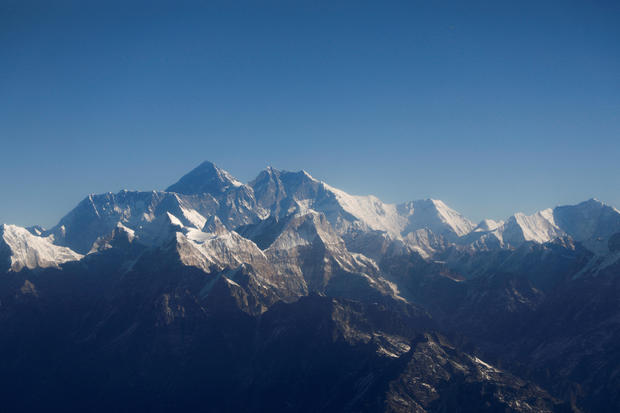 Mount Everest, the world's highest peak, and other peaks of the Himalayan range are seen through an aircraft window during a flight from Kathmandu, Nepal, January 15, 2020. 