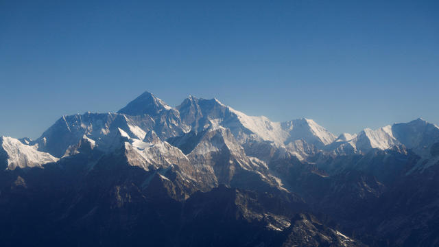 FILE PHOTO: Mount Everest, the world's highest peak, and other peaks of the Himalayan range as seen through an aircraft window during a flight from Kathmandu, Nepal. 
