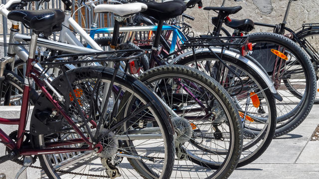 Bicycles parked in a row in a bicycle parking lot 