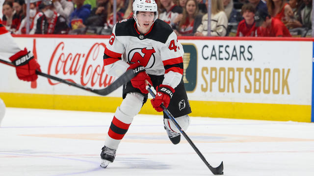 Luke Hughes #43 of the New Jersey Devils carries the puck up the ice during a game against the Washington Capitals at Capital One Arena on April 13, 2023 in Washington, D.C. 