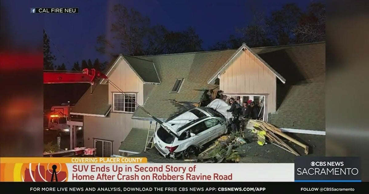 SUV crashes into second story of a home, injuring 1 person