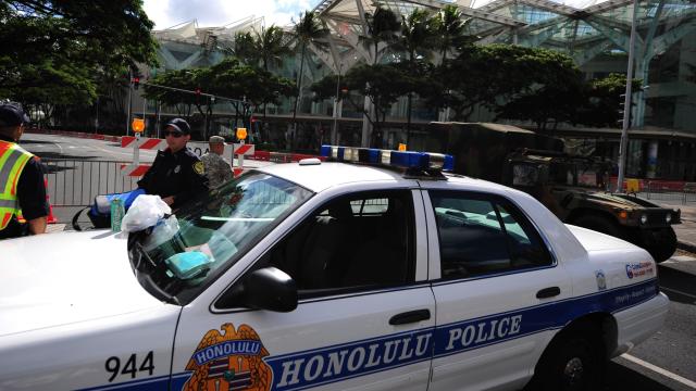 Honolulu police guard road closures around the Convention Center in Honolulu, Hawaii, on November 10 , 2011, during the Asia-Pacific Economic Cooperation (APEC) Summit. 