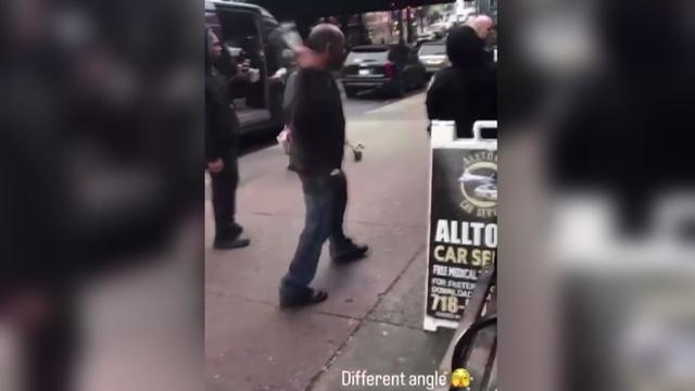 Video shows a man about to strike an NYPD officer in the head with a glass bottle. 