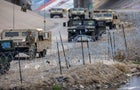 Texas National Guard soldiers stand guard at the U.S.-Mexico border on Jan. 7, 2023, as viewed from Ciudad Juárez, Mexico. 
