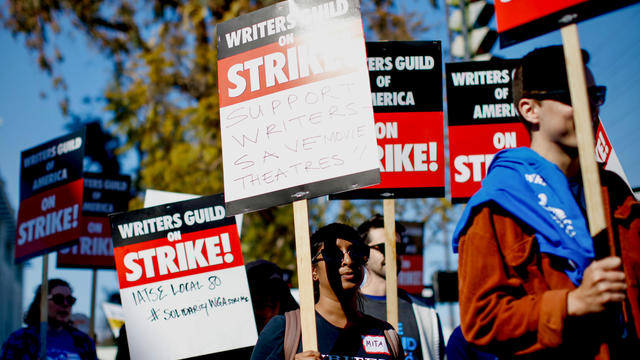 Writers' strike: Hollywood scribes picket studios for better pay. 'It's not sustainable' 