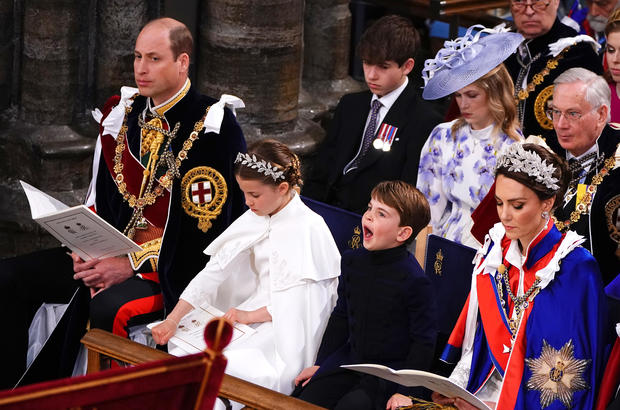 Prince Louis, son of William and Catherine, yawns during the coronation ceremony of King Charles III 