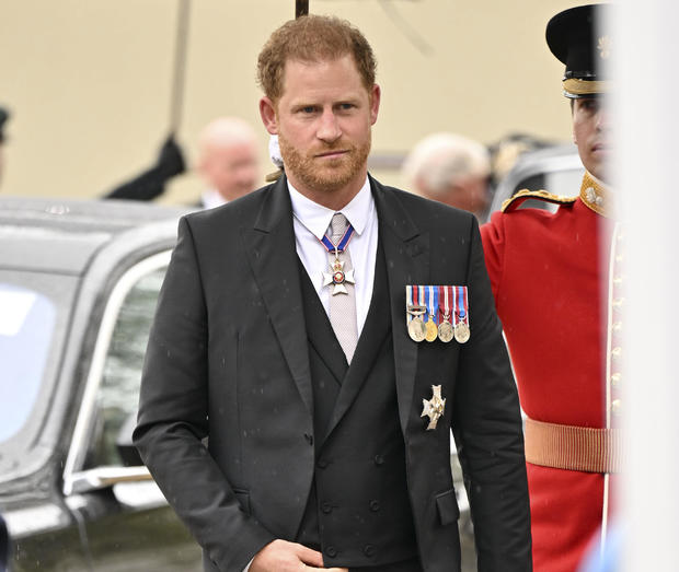 Prince Harry arrives for the Coronation of King Charles III 