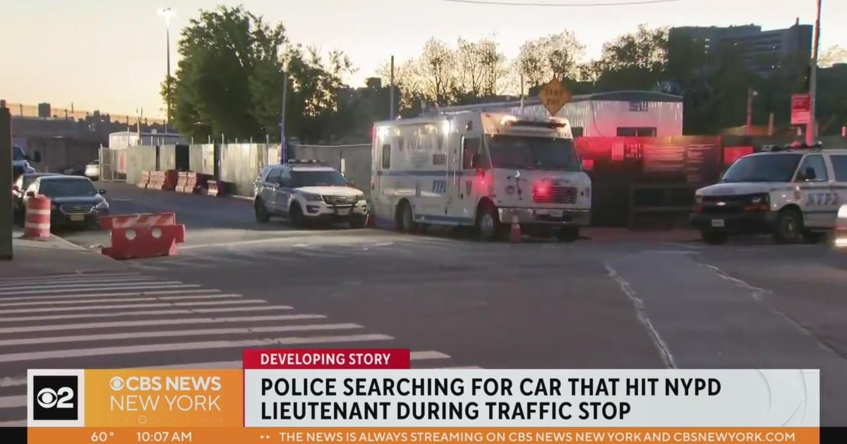 NYPD lieutenant struck by passing car during traffic stop - CBS New York