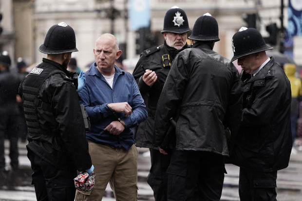 Police arrest an anti-monarchy demonstrator ahead of the procession of Britain's King Charles III to Westminster Abbey for his coronation in London, May 6, 2023