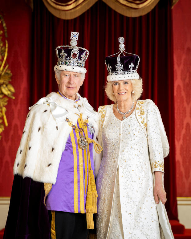 Britain's King Charles and Queen Camilla in their coronation attire and crowns 
