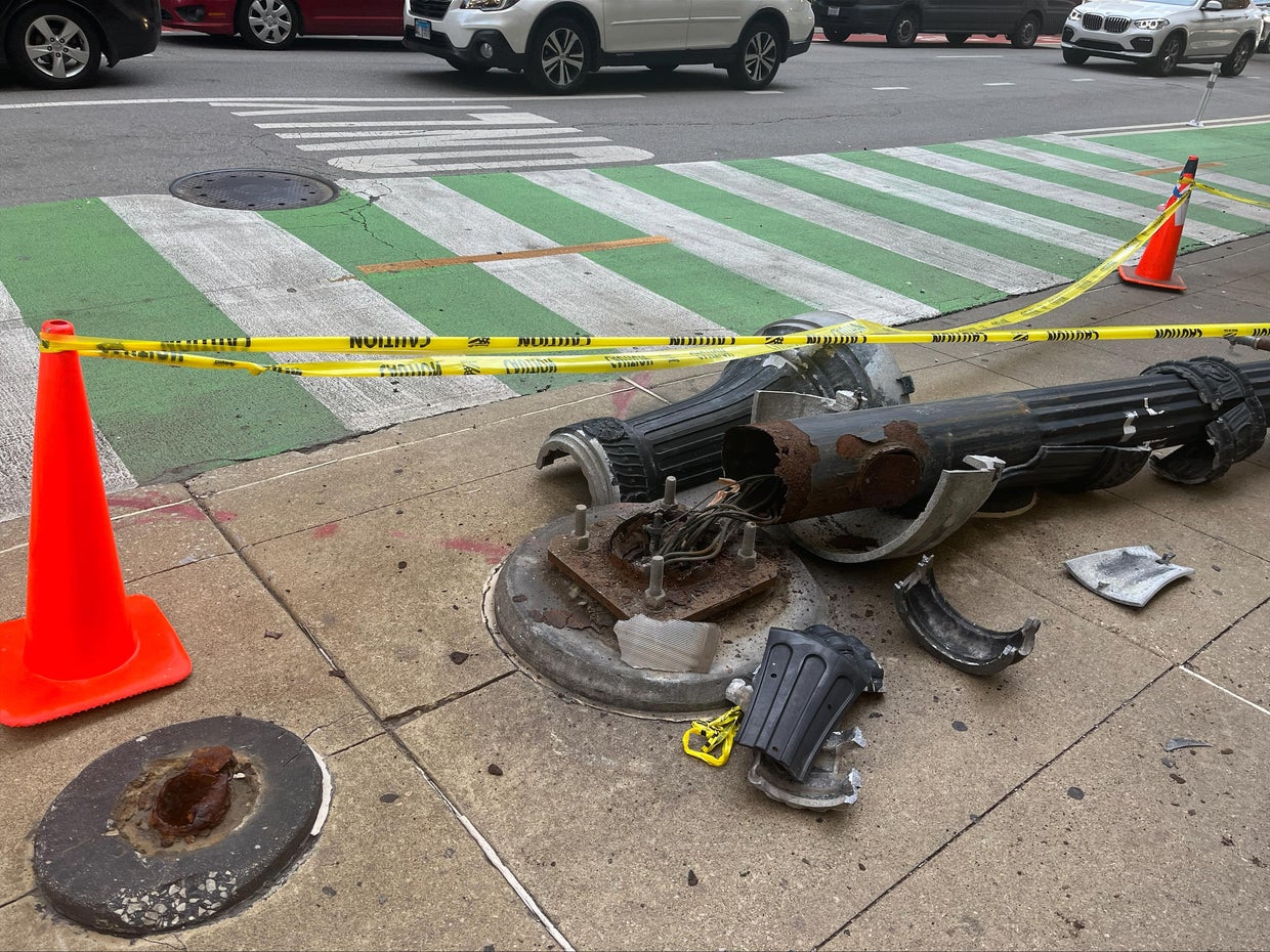 Light pole falls down after being hit by truck in Loop CBS Chicago