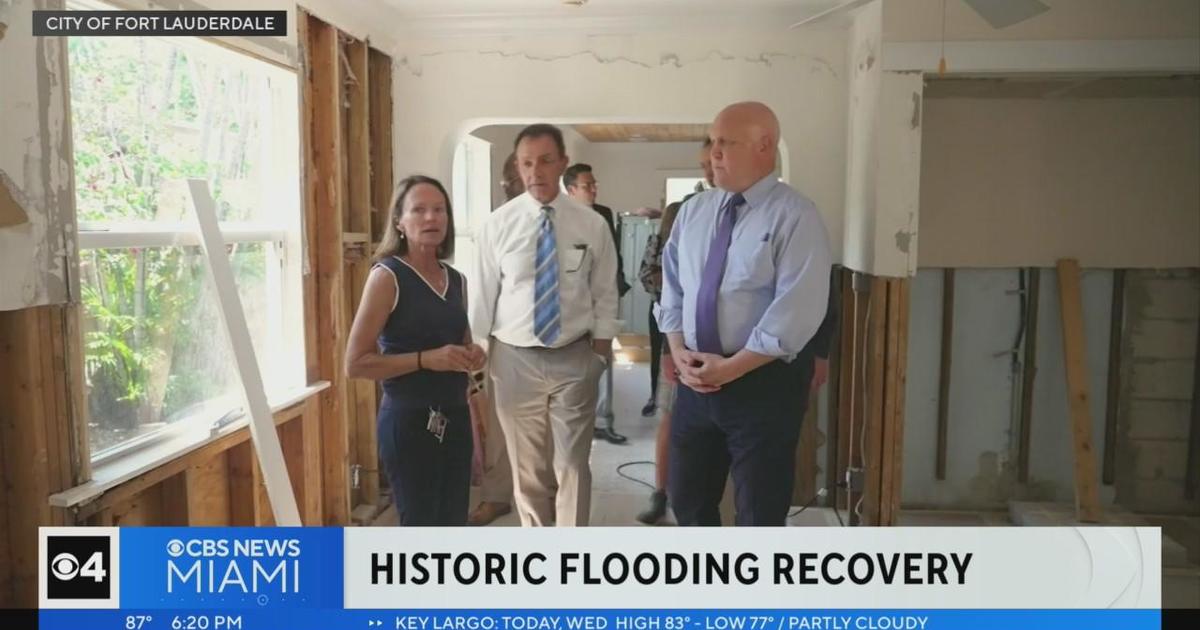 White House advisor Mitch Landrau toured flood ruined residences in Edgewater