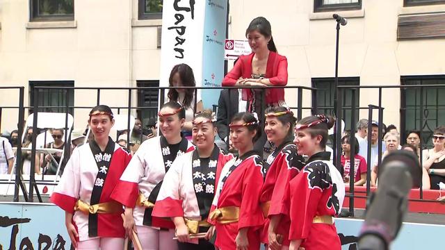 Kristi Yamaguchi poses for a picture with participants in the Japan Day Parade. 