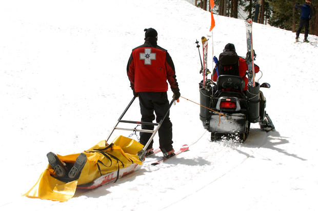 (HR) ABOVE: Members of the Keystone Ski Patrol take a skier off the mountain after she got hurt. This year has been the highest year of skier deaths in the mountains. Four of them alone at Keystone Resort. There seems to be no trend to the deaths with age 