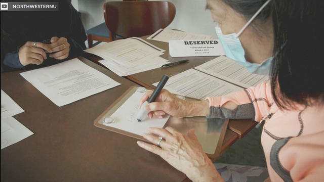 Home caregiver helping a senior woman standing in the bedroom 