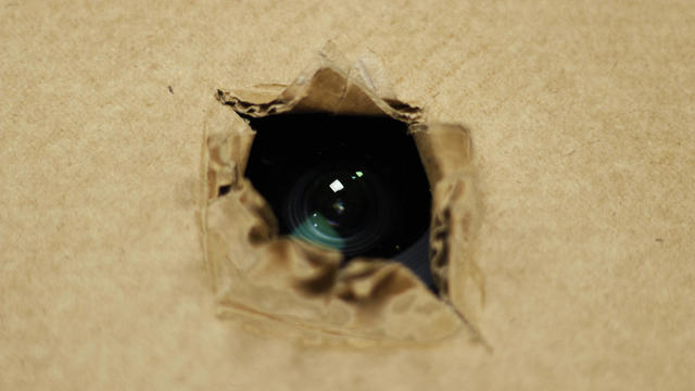 spy camera hidden fixed behind the cardboard or roof 