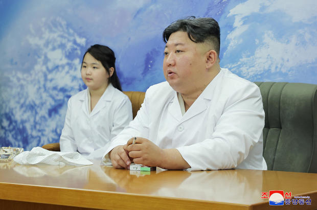 North Korean leader Kim Jong Un and his daughter Kim Ju Ae meet with members of the Non-permanent Satellite Launch Preparatory Committee in Pyongyang, North Korea May 16, 2023, in this image released by North Korea's Korean Central News Agency on May 17, 2023. 