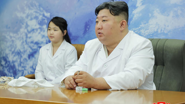 North Korean leader Kim Jong Un and his daughter Kim Ju Ae meet with members of the Non-permanent Satellite Launch Preparatory Committee in Pyongyang, North Korea May 16, 2023, in this image released by North Korea's Korean Central News Agency on May 17, 