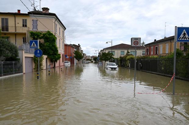 Floodwaters fill a street in the town of Lugo on May 18, 2023, after heavy rains caused flooding across Italy's northern Emilia Romagna region