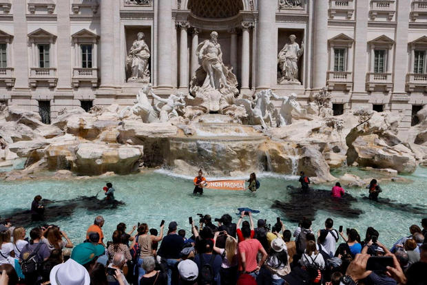 Trevi Fountain water turned black by climate activists protesting fossil fuels
