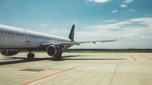 Airplane parked on the airfield 