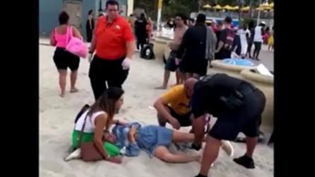 hollywood-florida-boardwalk-mass-shooting-victim-tended-to-by-officer-052923.jpg 