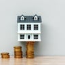 House Model on Top of Stack of Coins 