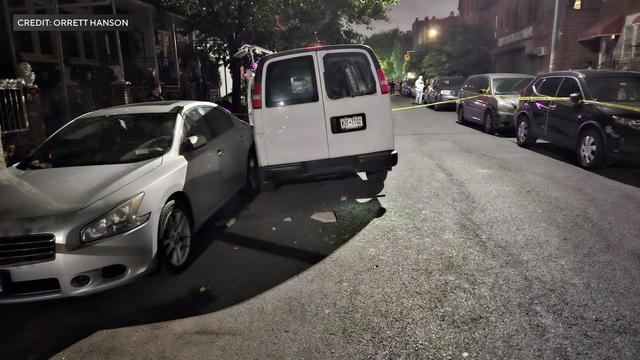 A white van sits crashed into parked cars going the wrong way on a Brooklyn street. 
