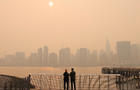 Haze and smoke caused by wildfires in Canada hang over the Manhattan skyline, in New York City 