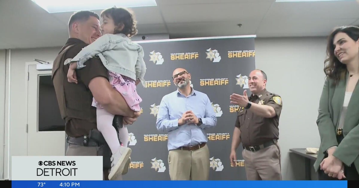 Macomb County deputies reunite with toddler they rescued from nearly ...