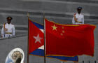 Cuban and China flags wave at the Jose Marti monument during a ceremony for China's President Hu Jintao, unseen, in Havana, Tuesday, Nov. 18, 2008. 