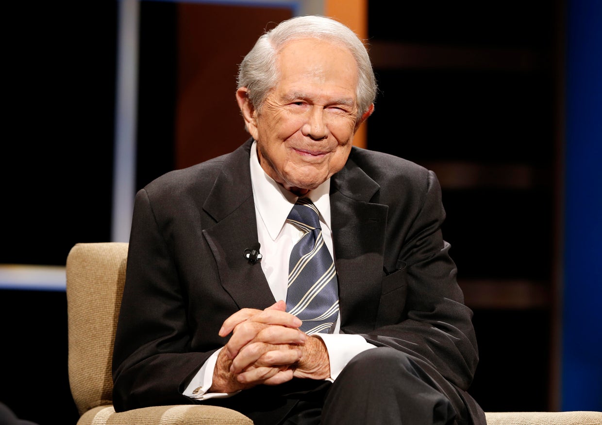 The Rev. Pat Robertson poses a question to a Republican presidential candidate during a forum at Regent University in Virginia Beach, Va., Oct. 23, 2015. 