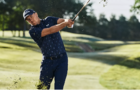 Man golfing in Under Armour clothing 