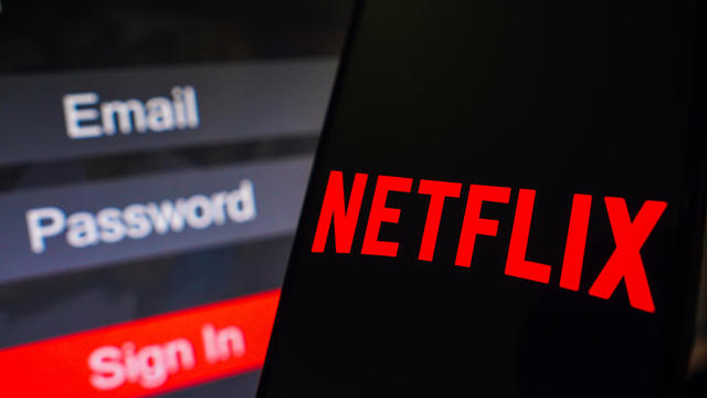 In this photo illustration, the Netflix logo is displayed on 