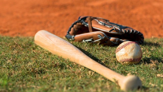 Baseball Bat Mitt and Ball on Diamond 