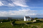 Neat whitewashed Irish cottage on the island of Inishee 