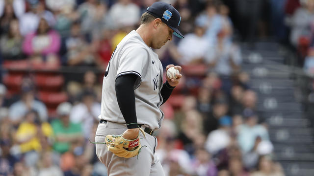 Relief pitcher Nick Ramirez #63 of the New York Yankees walks back to the mound after balking in a run during the seventh inning of game one of a doubleheader against the Boston Red Sox at Fenway Park on June 18, 2023 in Boston, Massachusetts. 