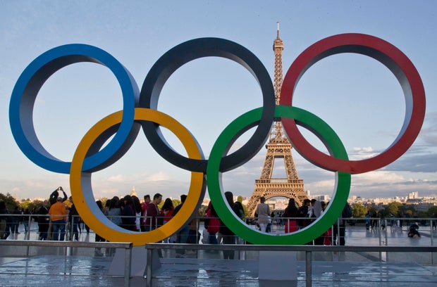 The Olympic rings are set up in Paris, France, overlooking the Eiffel Tower