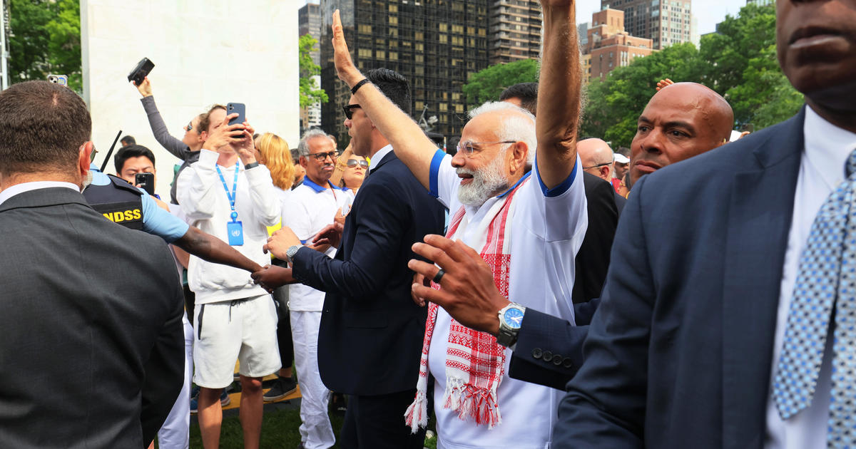 India leader Modi uses yoga "to unite" at U.N. ahead of Biden meeting, but many see him as a divider