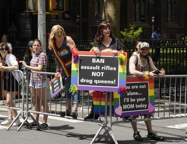 A sign reads "Ban Assault Rifles, Not Drag Queens" at the 2023 New York City Pride March on June 25, 2023 in New York City. 