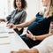 Pregnant Woman Working With Colleagues At Office 