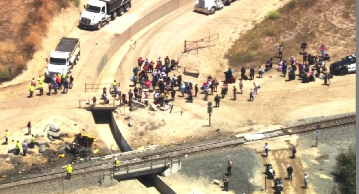 Crews continue to clear derailed Amtrak train after collision with ...