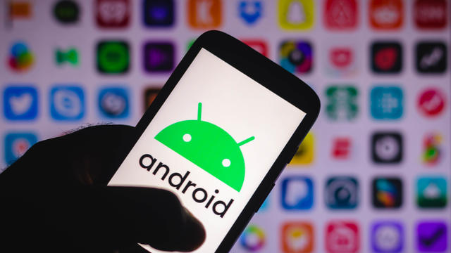 In this photo illustration an Android logo seen displayed on 