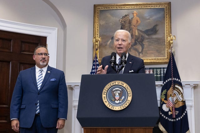 President Biden speaks alongside Education Secretary Miguel Cardona in the Roosevelt Room of the White House on Friday, June 30, 2023.