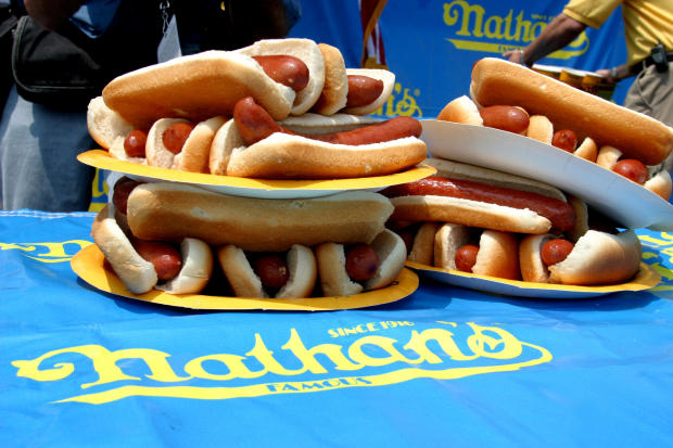 A pile of hot dogs and buns at the Nathan's Famous Hot Dog Eating Contest 