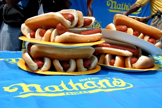 A pile of hot dogs and buns at the Nathan's Famous Hot Dog Eating Contest