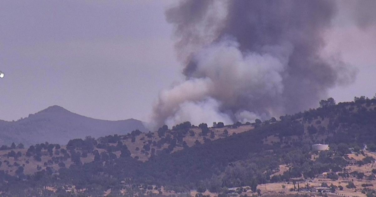 Fast-spreading vegetation fire burns near Valley Springs