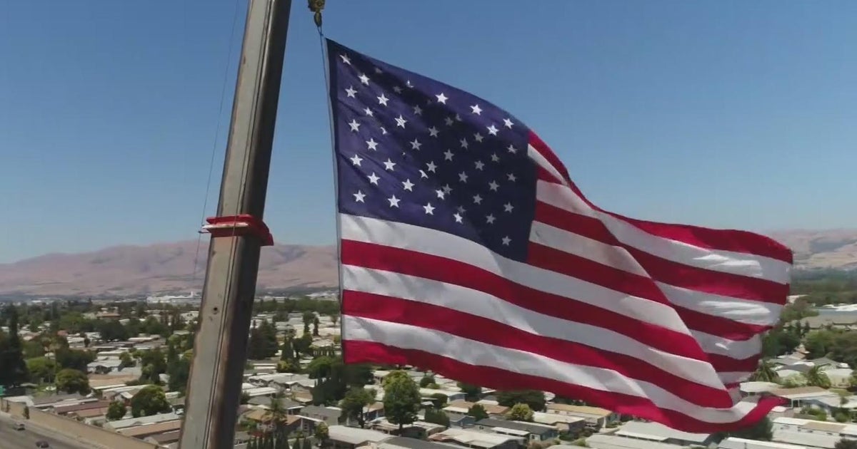 Massive American flag flies above San Jose business for July 4th